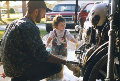 Cleo washing the bike